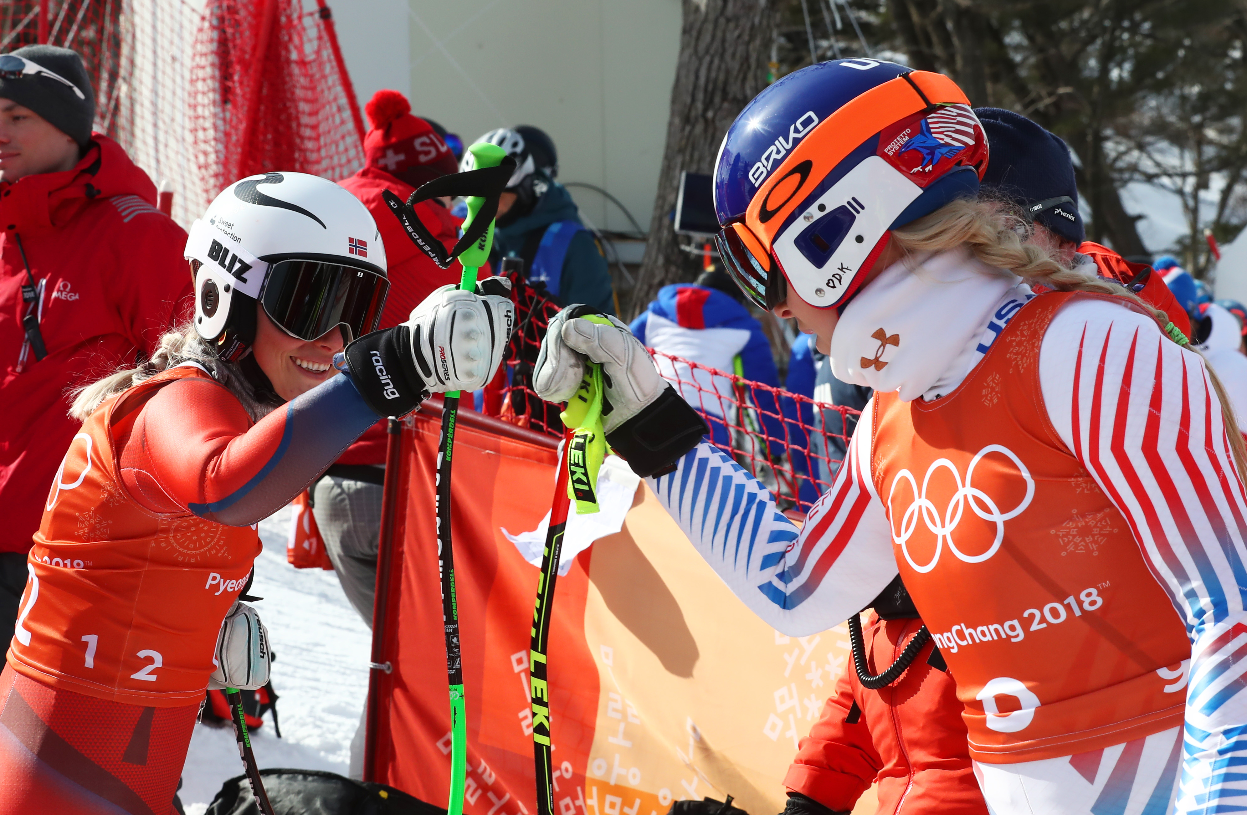 Lindsey Vonn and Ragnhild Mowinckel of Norway fist bump after the third training downhill training run Tuesday at Jeongseon Alpine Centre. (Getty Images - Alexander Hassenstein)