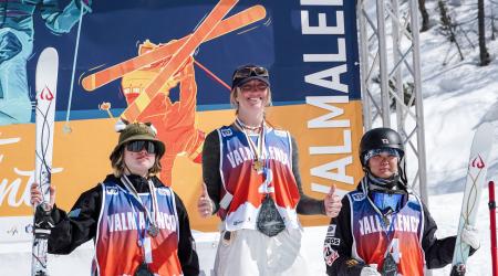 Kylie Kariotis smiles on the top box after winning the dual moguls Junior World Championship podium in Valmalenco, Italy