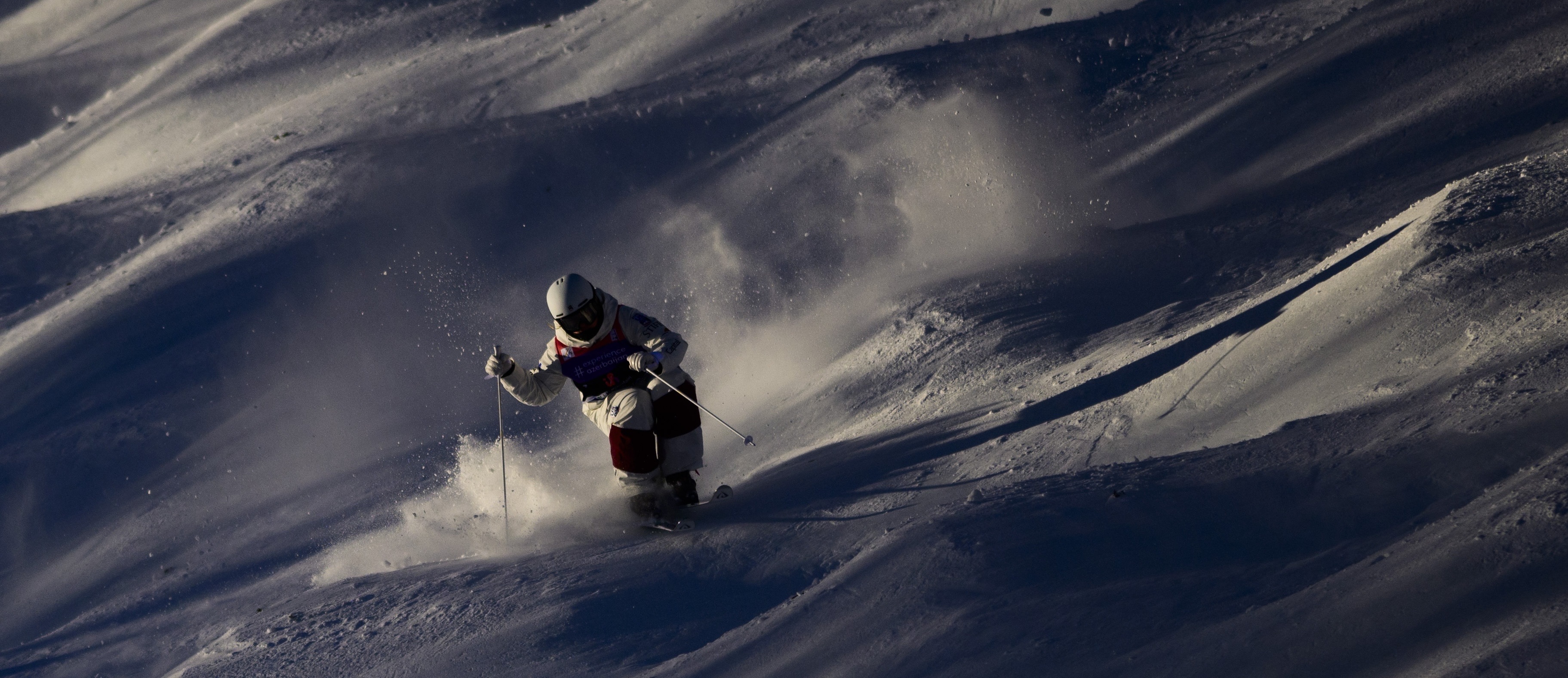 Olivia Giaccio skis in the moguls at the Intermountain Health Freestyle International presented by Stifel in Waterville Valley, New Hampshire