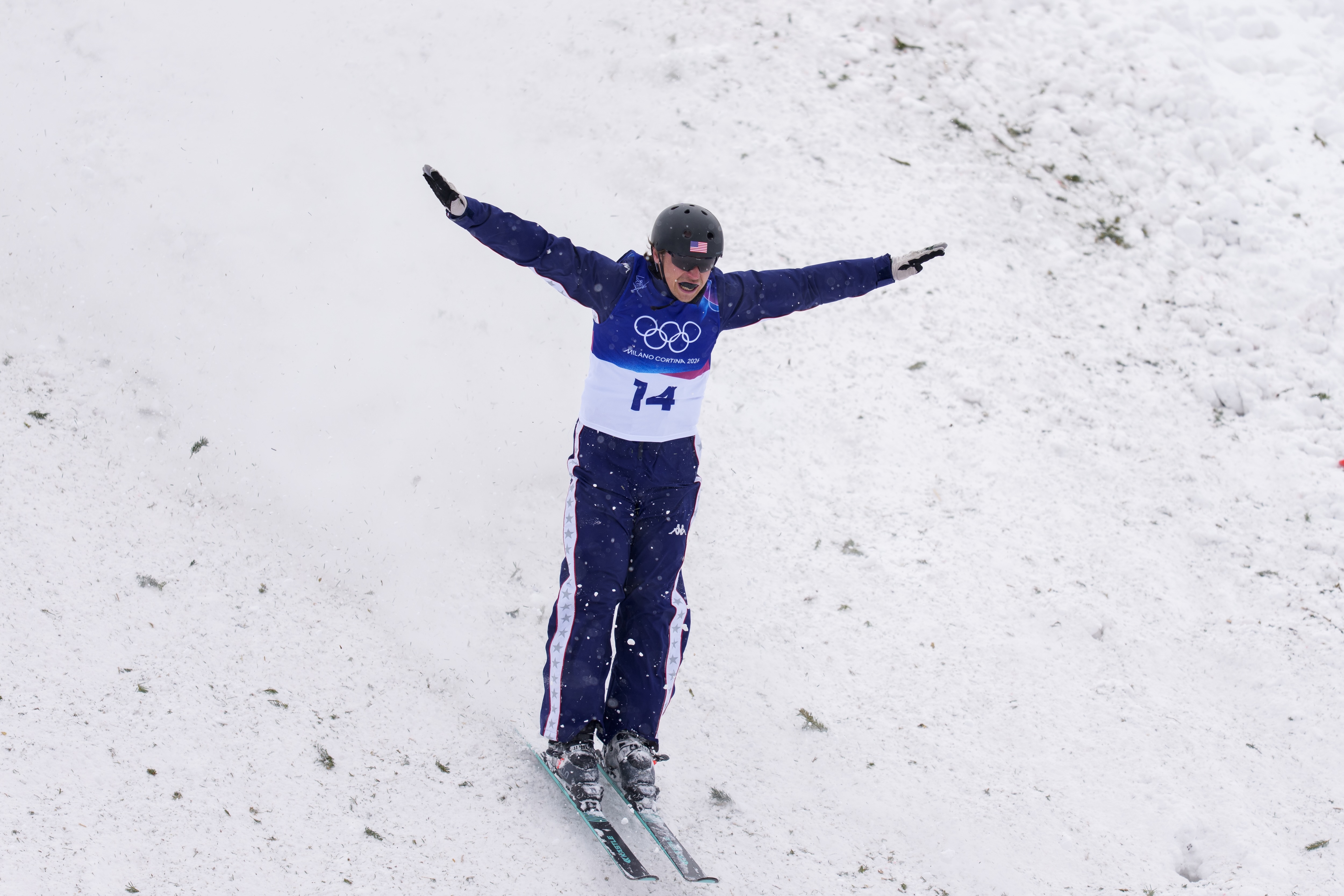 Derek Krueger lands a jump at the 2026 Olympic Winter Games