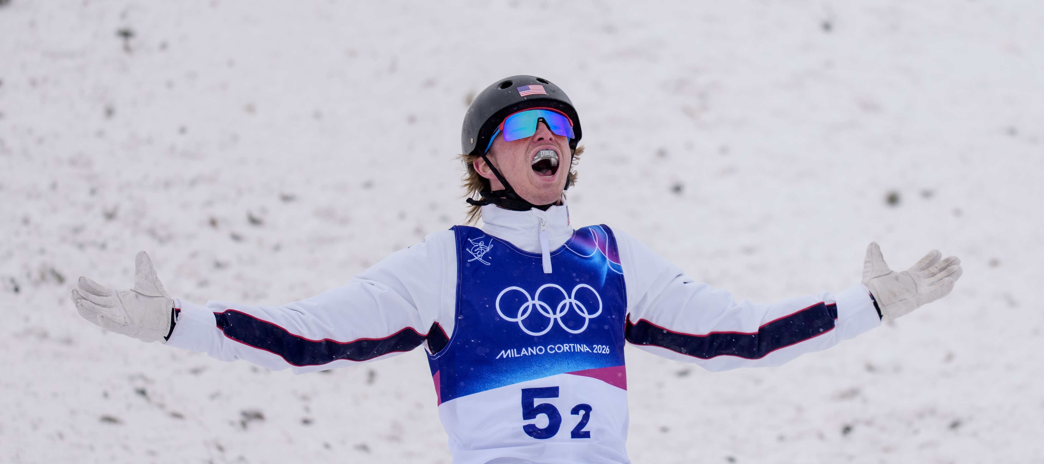 Connor Curran celebrates after a landed jump at the 2026 Olympic Winter Games