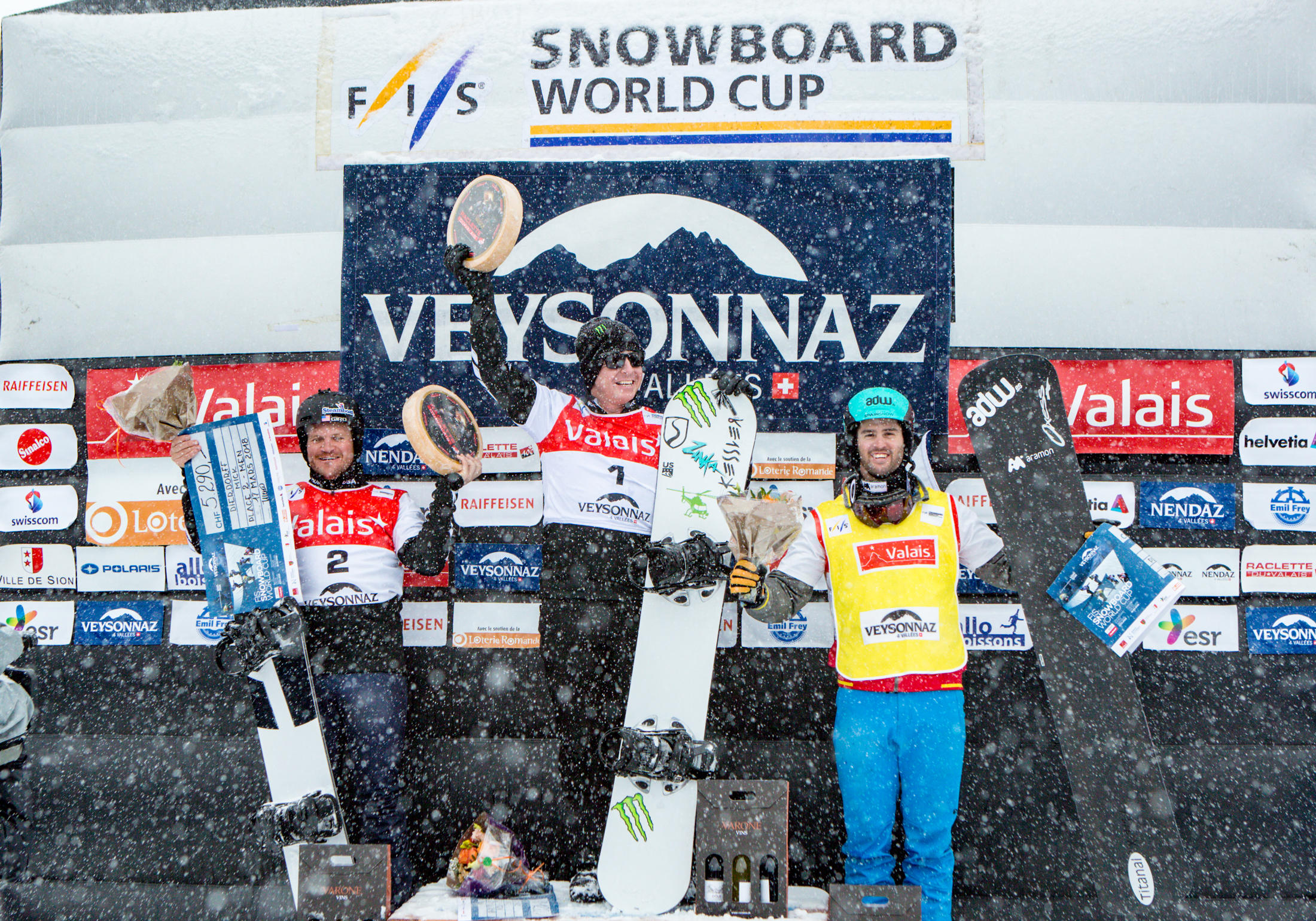 Nate Holland and Mick Dierdorff celebrate their 1-2 finish in Saturday's FIS Snowboardcross World Cup Veysonnaz, Switzerland. (FIS)