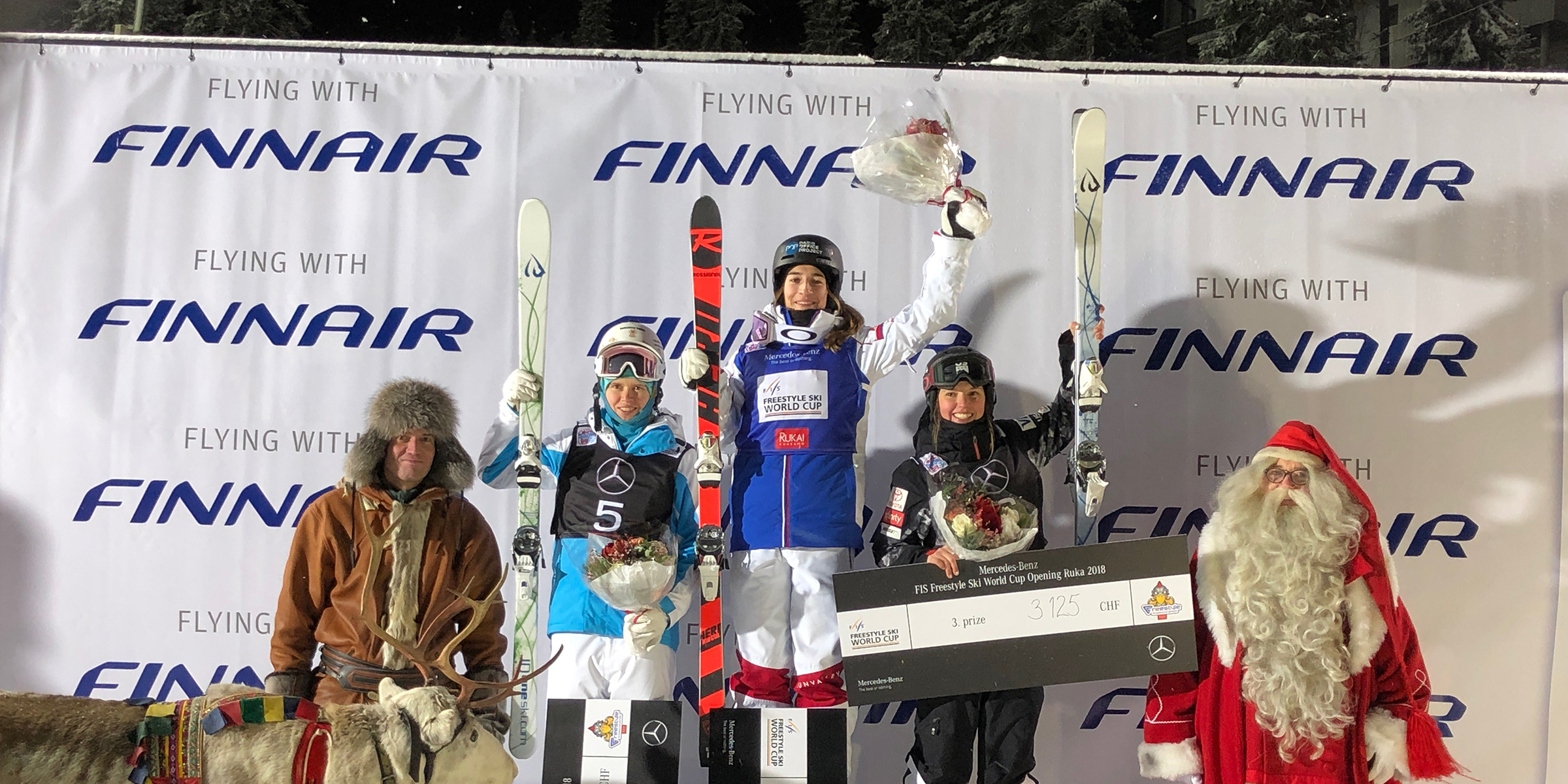 Tess Johnson, who took third in Friday's FIS Freestyle World Cup moguls event, shared the podium with France’s Perrine Laffont, who came in first, and Kazakhstan’s Yulia Galysheva, who came in second. (Matt Gnoza - U.S. Ski & Snowboard)