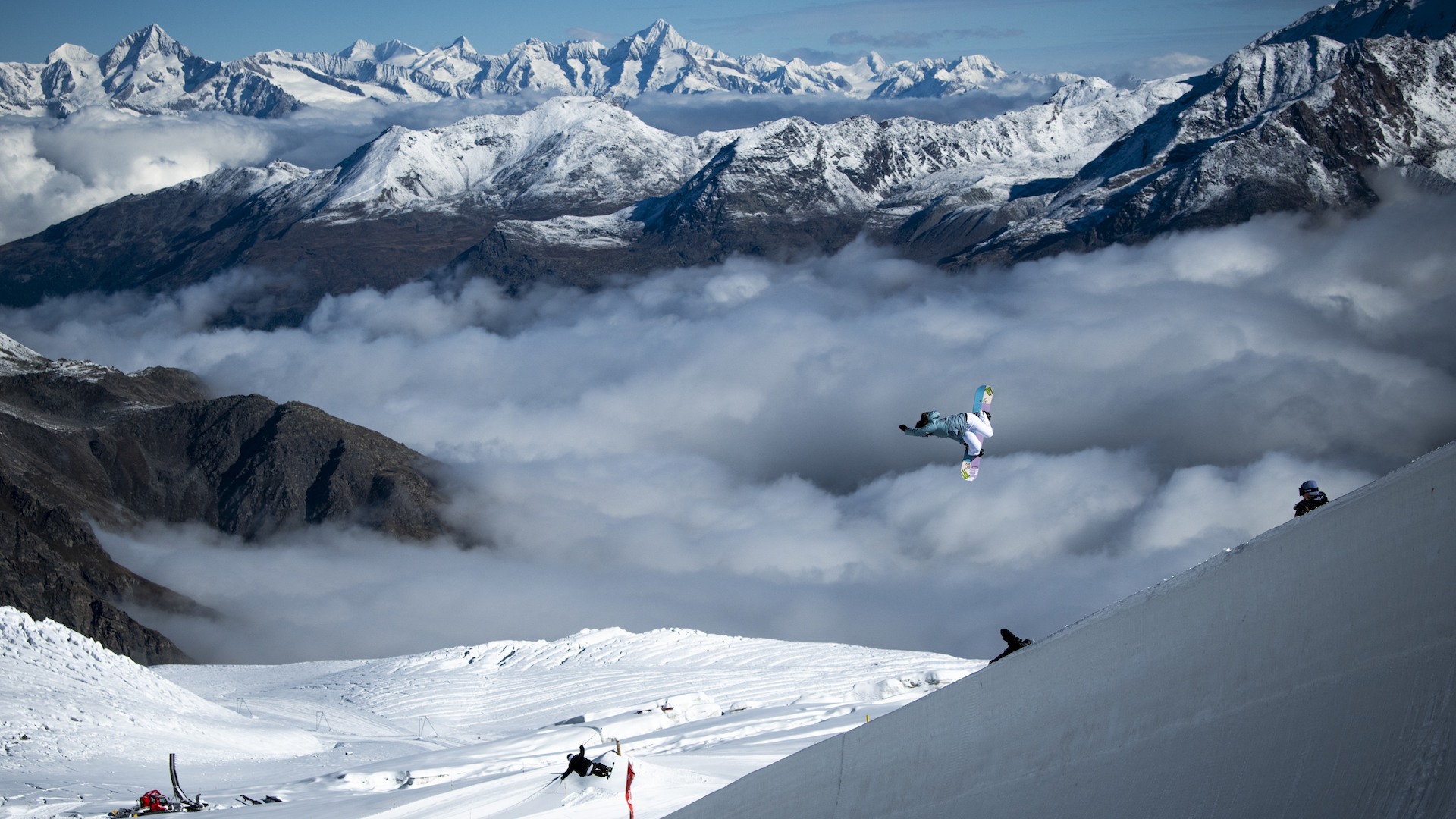 A snowboarder airs out of the halfpipe in Saas Fee. 