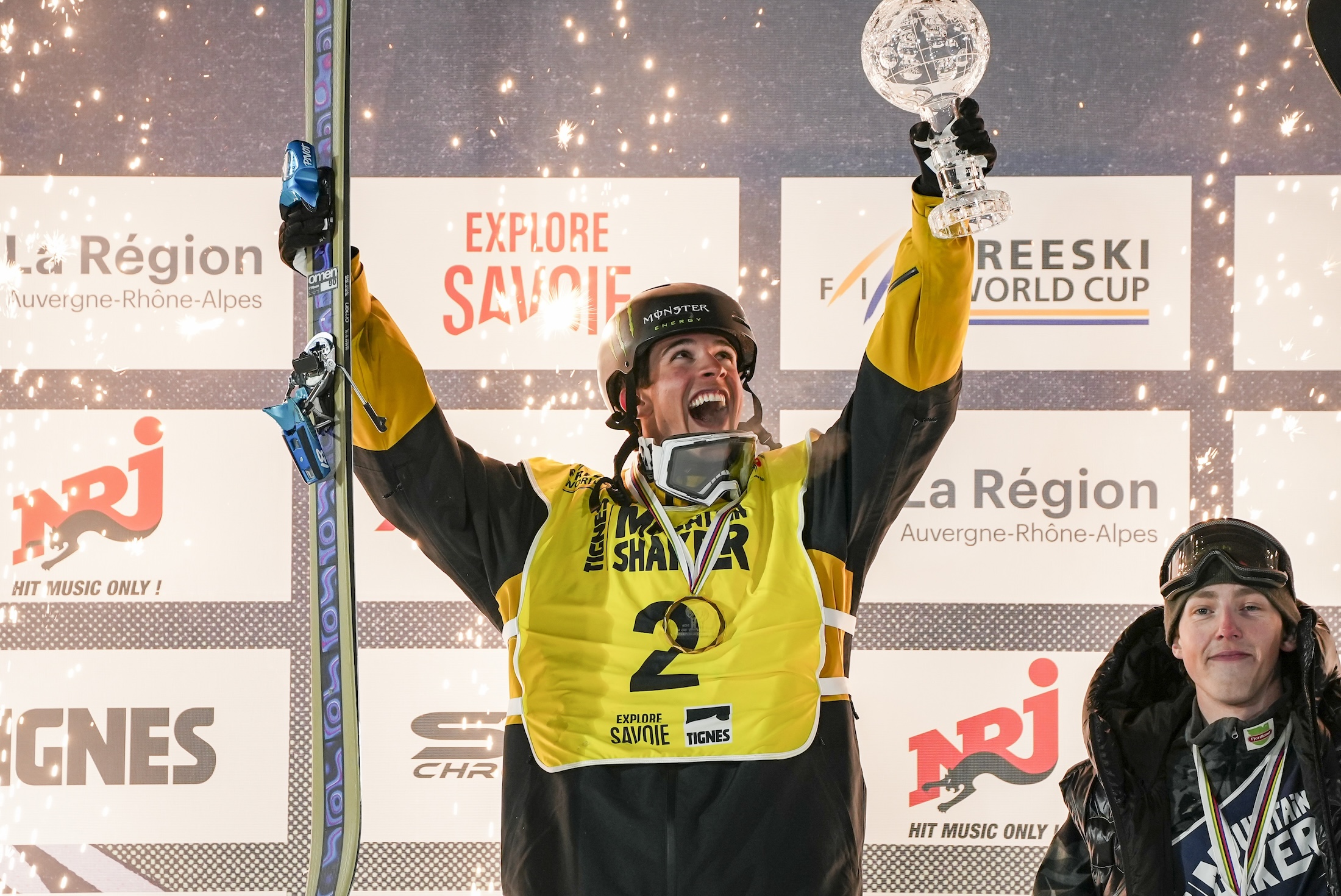 Troy Podmilsak hoisting the big air Crystal Globe