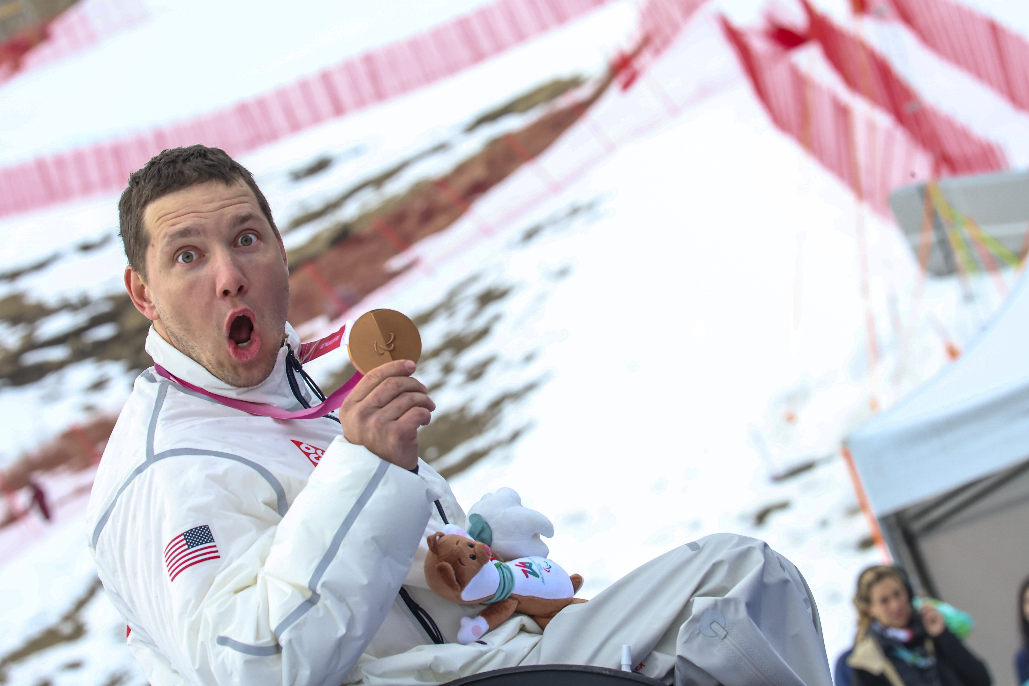 Andrew Kurka smiles on the Paralympic podium in Cortina