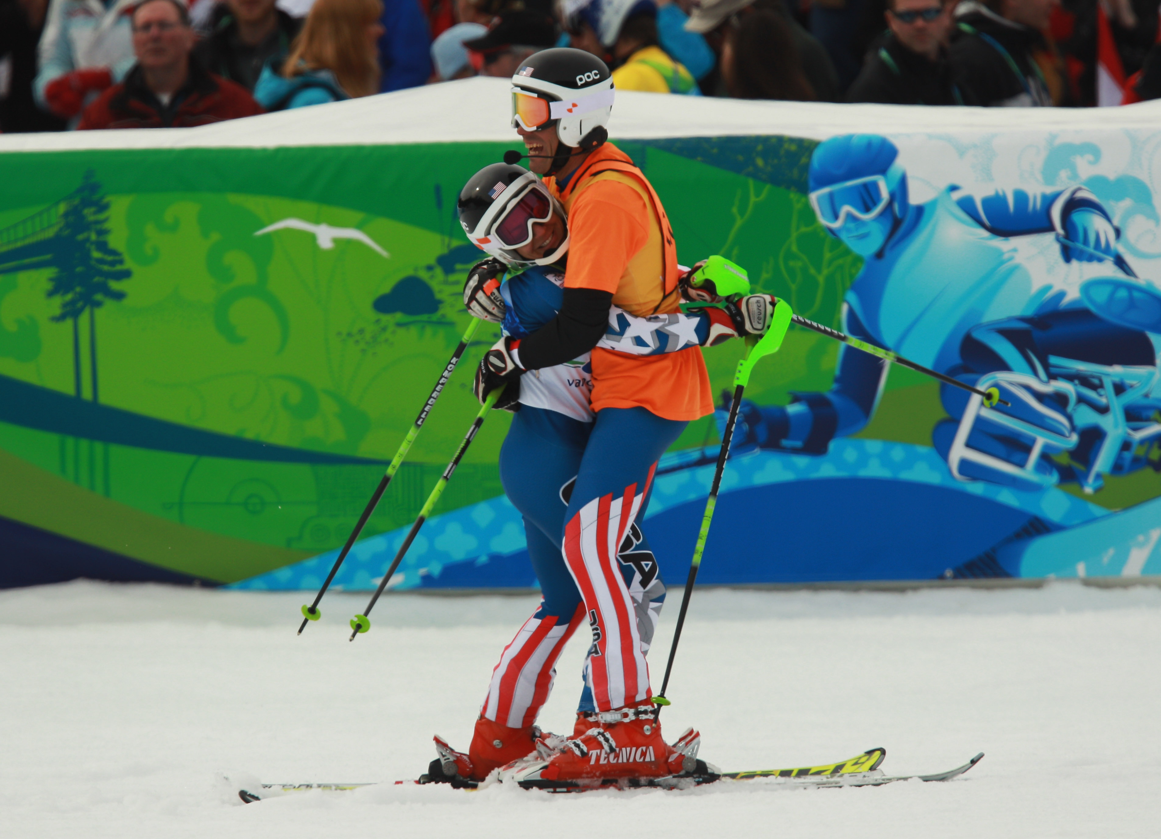 Danelle Umstead and guide Rob Umstead celebrate after the Women's Visually Impaired Super Combined during the 2010 Vancouver Winter Paralympics on March 20, 2010.