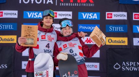 Alessandro Barbieri and Maddy Schaffrick stand on the podium