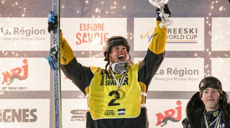 Troy Podmilsak hoisting the big air Crystal Globe